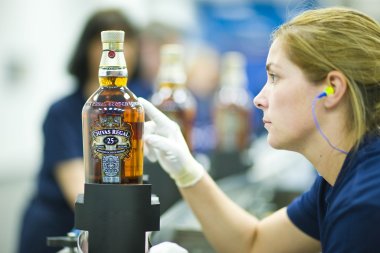 Chivas Regal 25 being checked at new luxury bottling facilities installed by Chivas Brothers at its Paisley site.